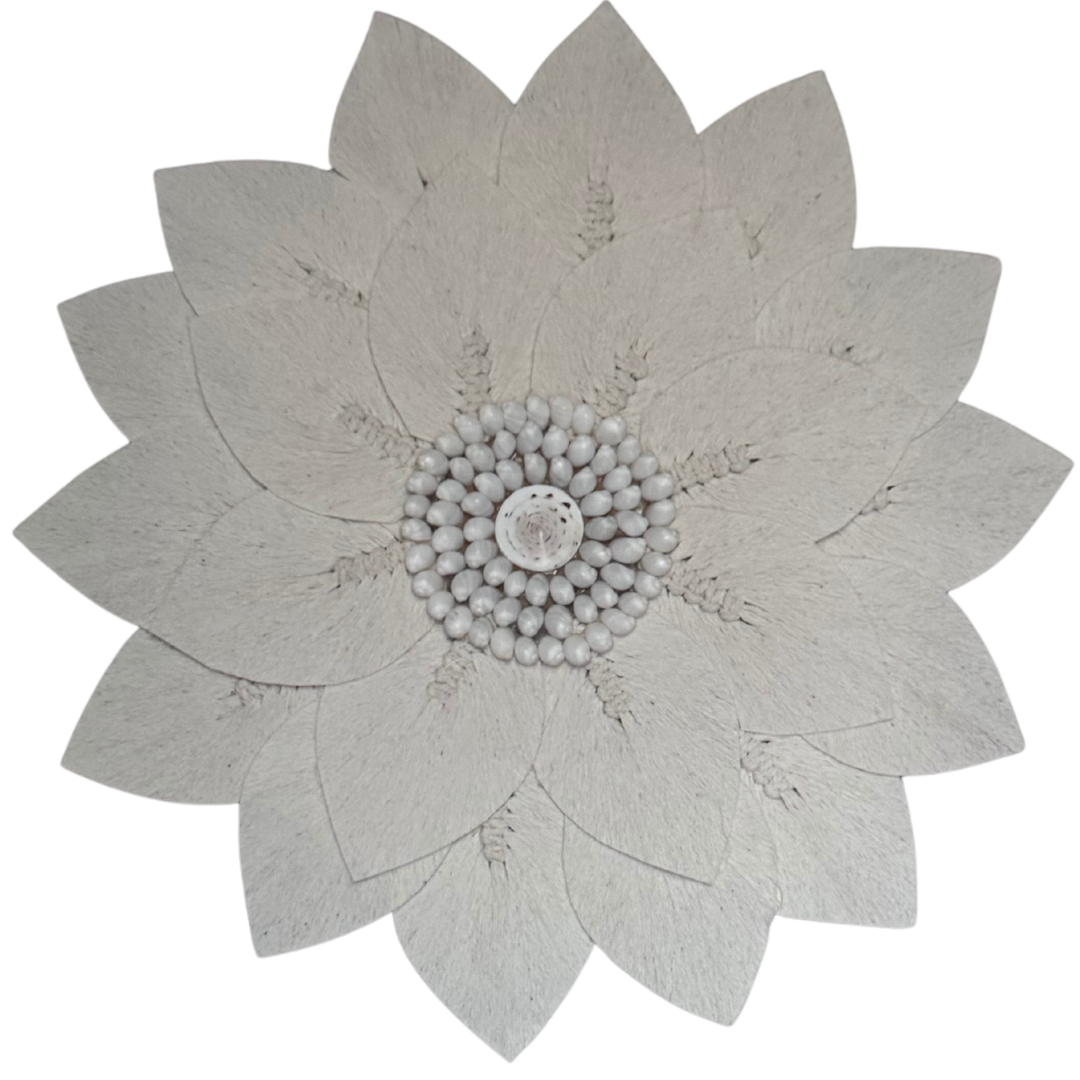 close up photo Macramé decorative wall mirror with a floral sunburst design on a white background, handcrafted boho coastal wall décor.