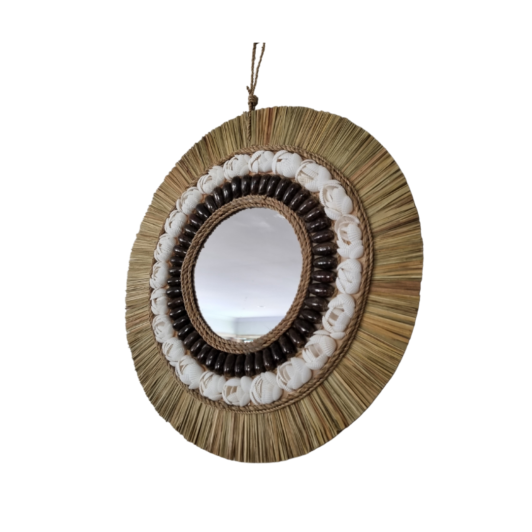 Round mirror with natural materials on a white background