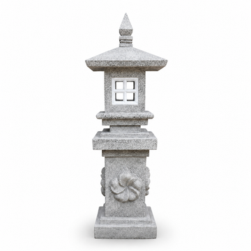 Light grey concrete pagoda lantern with four-pane square window, carved spiral relief on column and pointed finial on white background