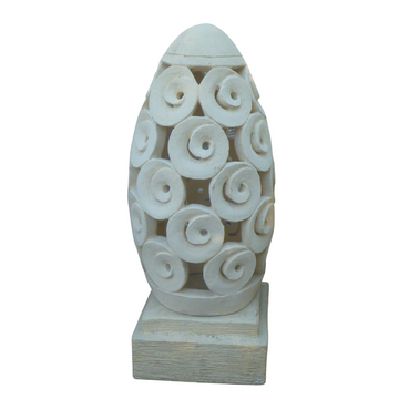 Close-up of the Spiral motif concrete garden lantern from the Dome Collection – handcrafted in Bali with swirling circular cutouts on a square base, in neutral cream.