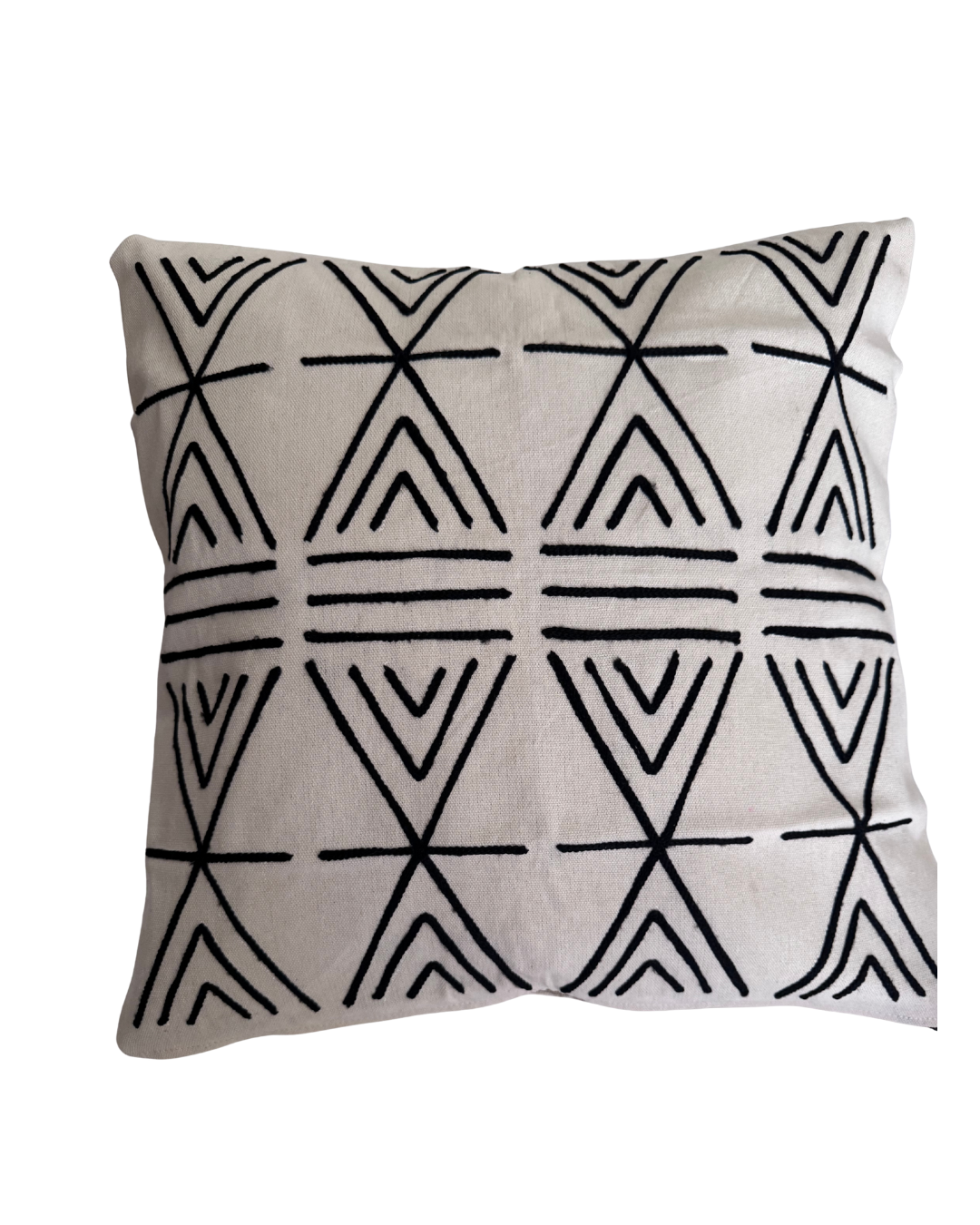 Decorative pillow with black geometric pattern on a beige background