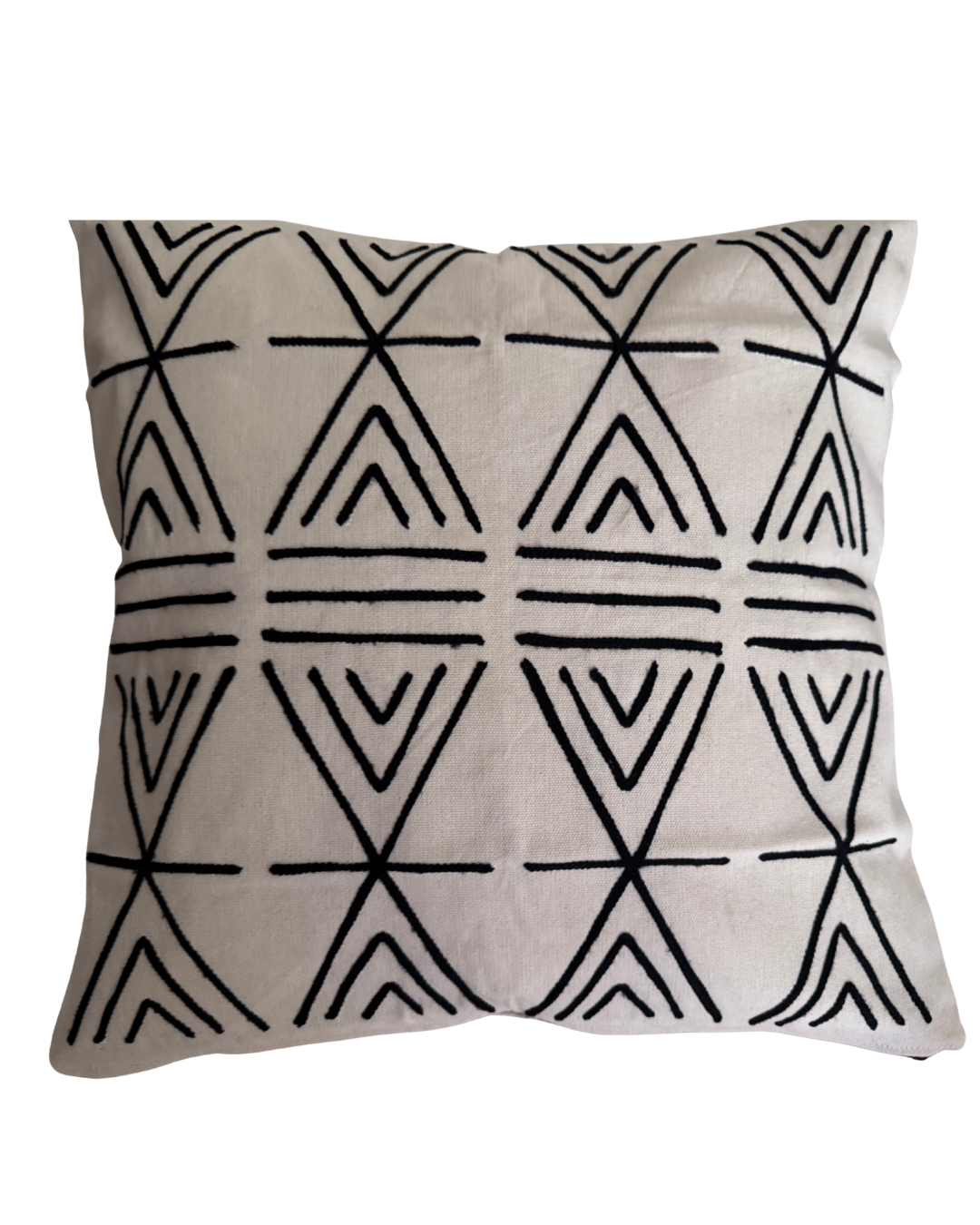 Decorative pillow with black geometric pattern on a beige background