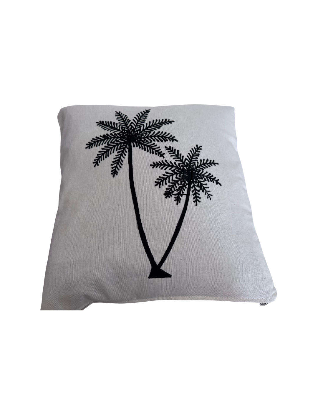 Gray pillow with black palm tree design on a white background