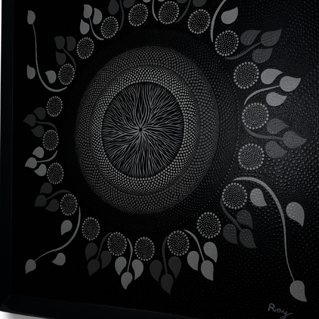 angle shot A dot art painting on a dark canvas, featuring a spiral center with leaf-like shapes and a pattern of dots in black, white, and gray radiating outward.