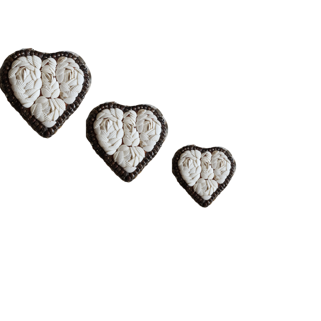 A set of three heart-shaped decorative shell trinket boxes in various sizes, with a white interior and a brown shell exterior.
