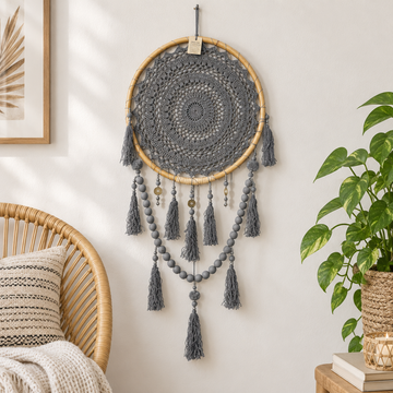Grey crochet wall hanging with bead strands and long tassels