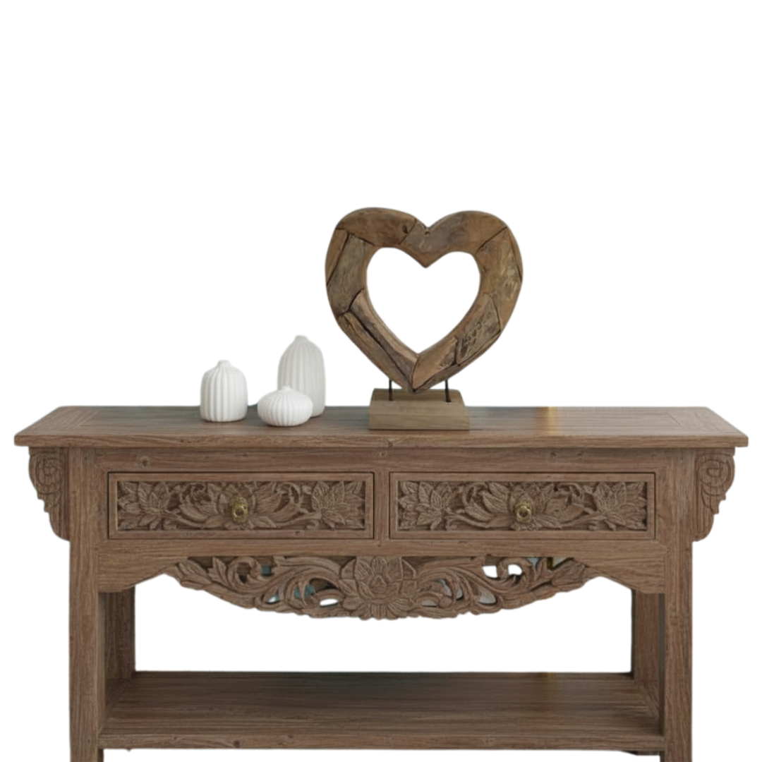 Wooden console table with decorative heart sculpture and white vases on a white background