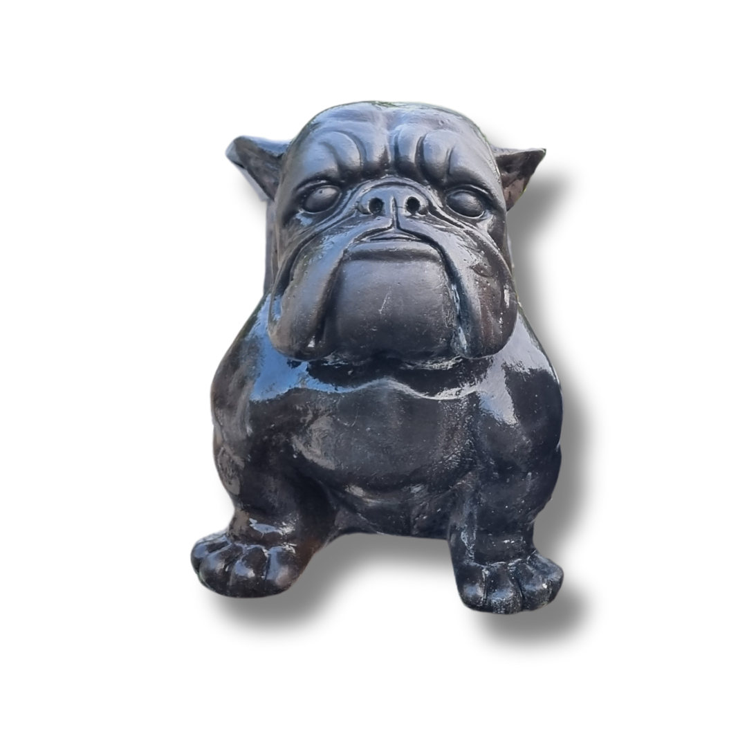 Black  bulldog figurine on a white background