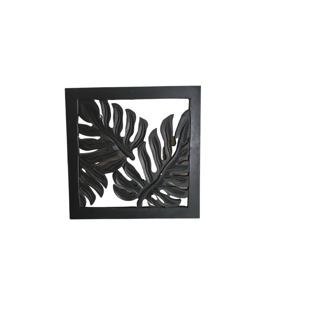 Decorative wall art with leaf design on a white background