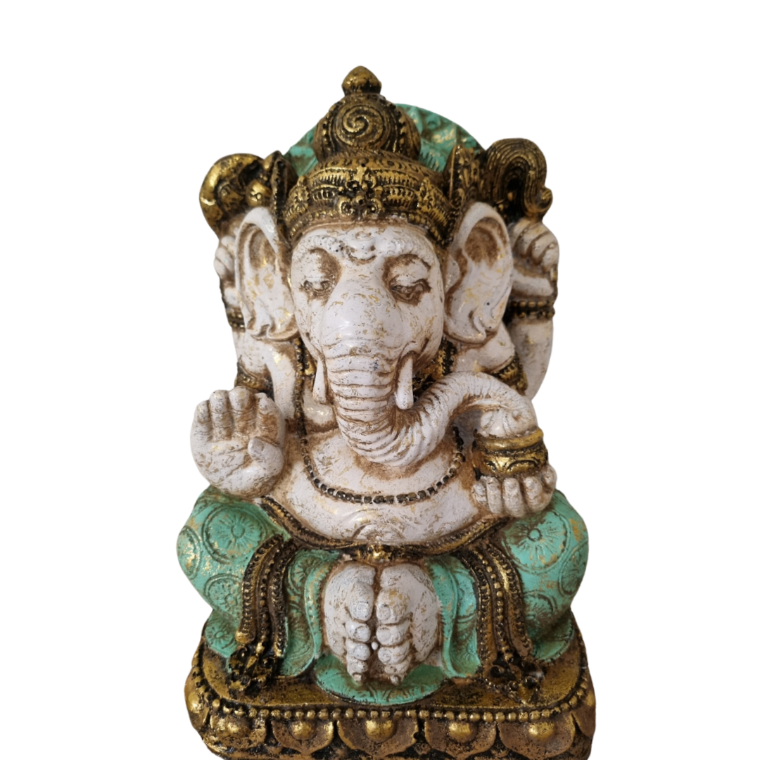 Decorative statue of a deity with intricate details on a white background