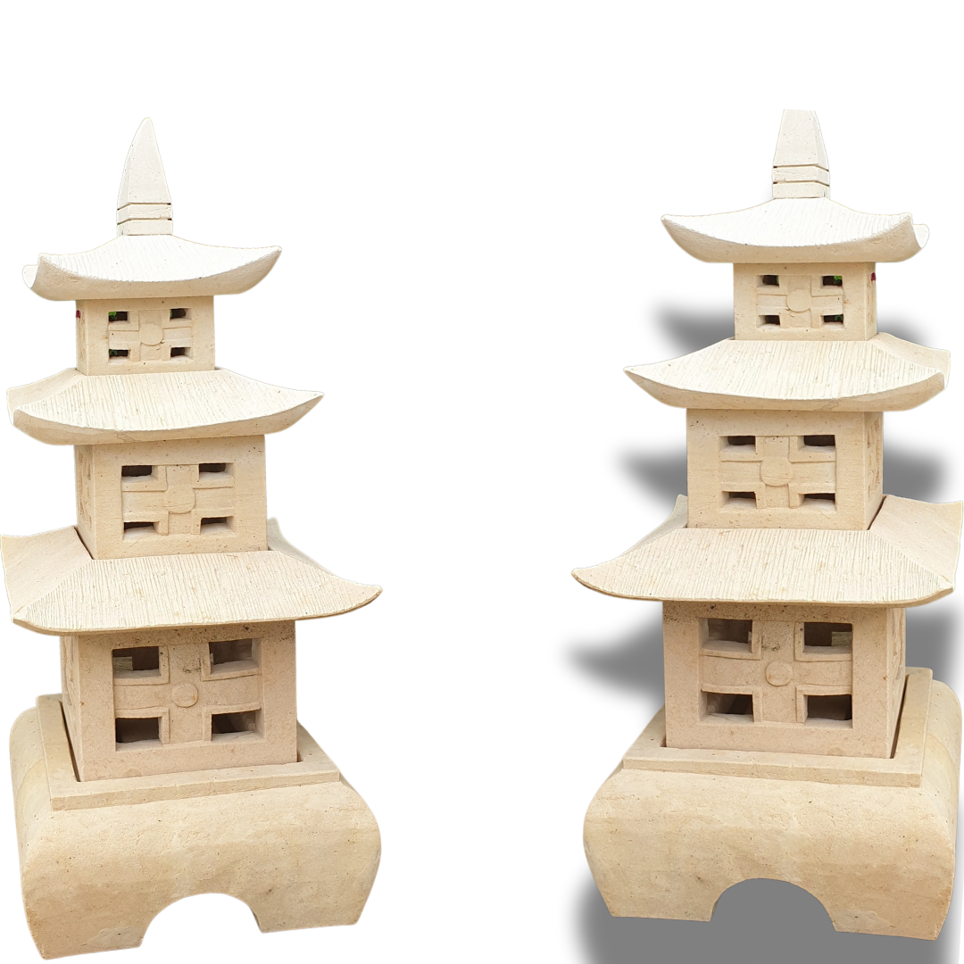 Two three-tier stone pagoda sculptures shown side by side, front and angled view, carved lattice windows, white background