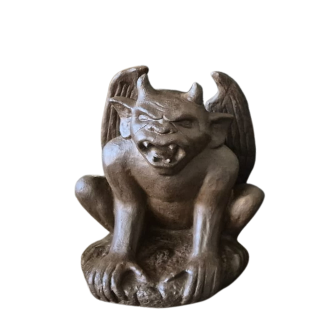 A rustic style gargoyle garden statue made from reinforced concrete and glass fiber, displayed in a natural outdoor setting.