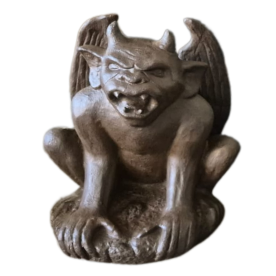 Statue of a gargoyle-like creature on a white background