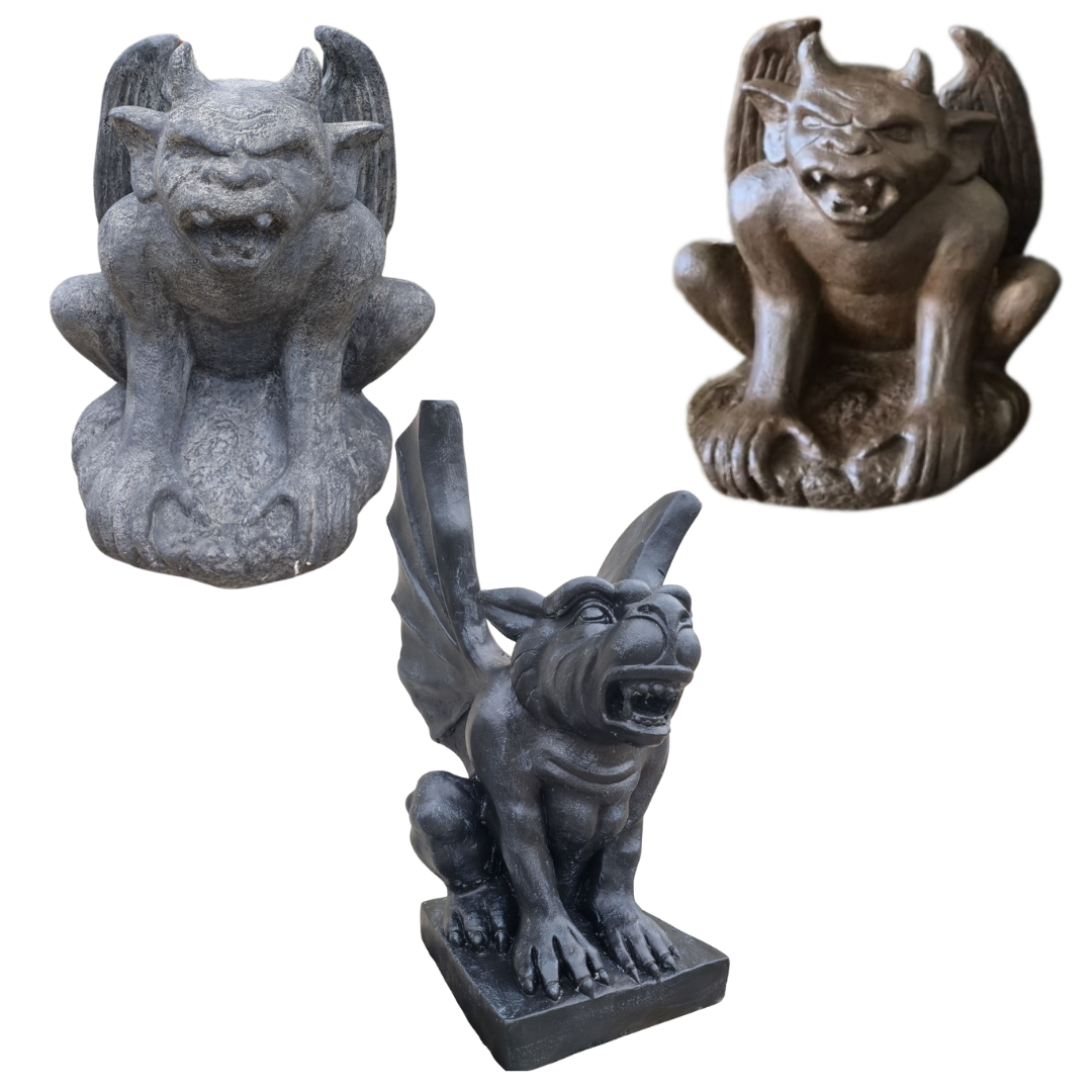 Three gargoyle statues in different colors on a white background