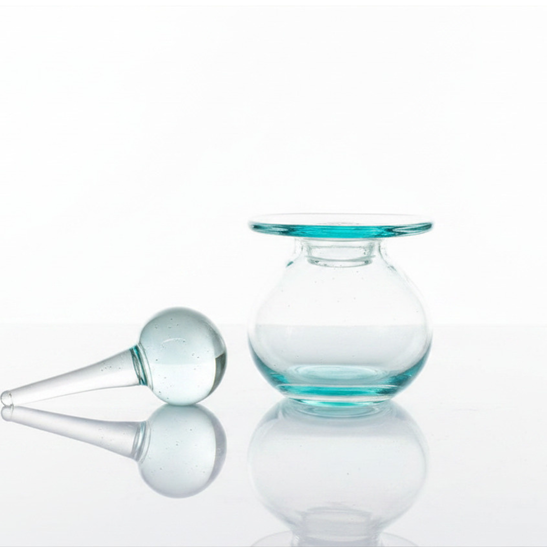 Round tinted vessel with wide flat collar and ball-tipped stopper, open view