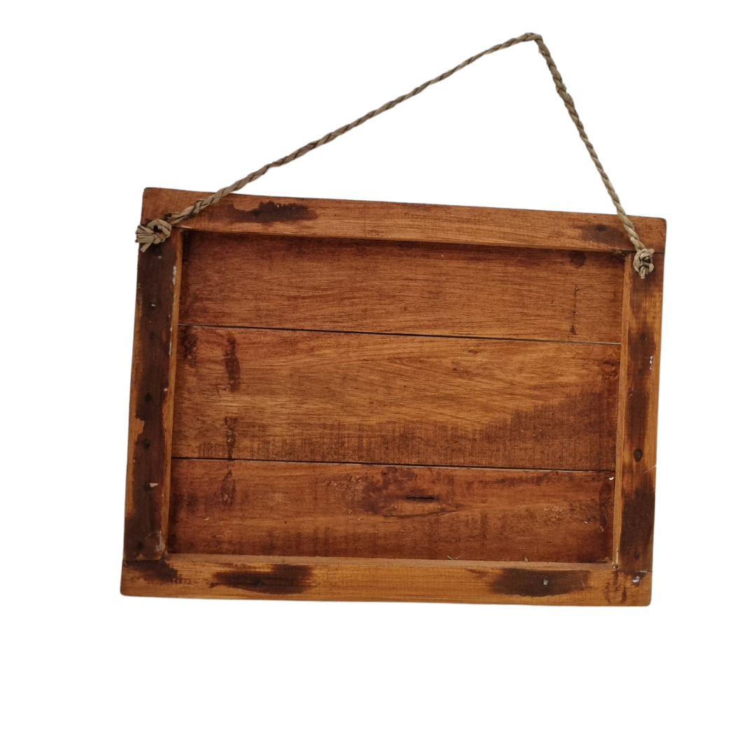 Reverse side of rustic wooden wall sign showing solid timber plank construction with framed edges and jute rope hanger
