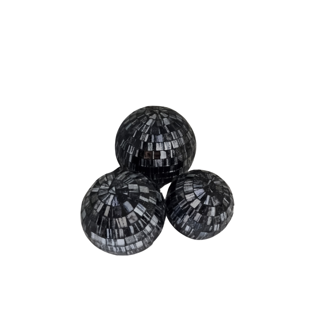 Three mosaic decorative balls in gray, each with a geometric pattern made of small tiles.