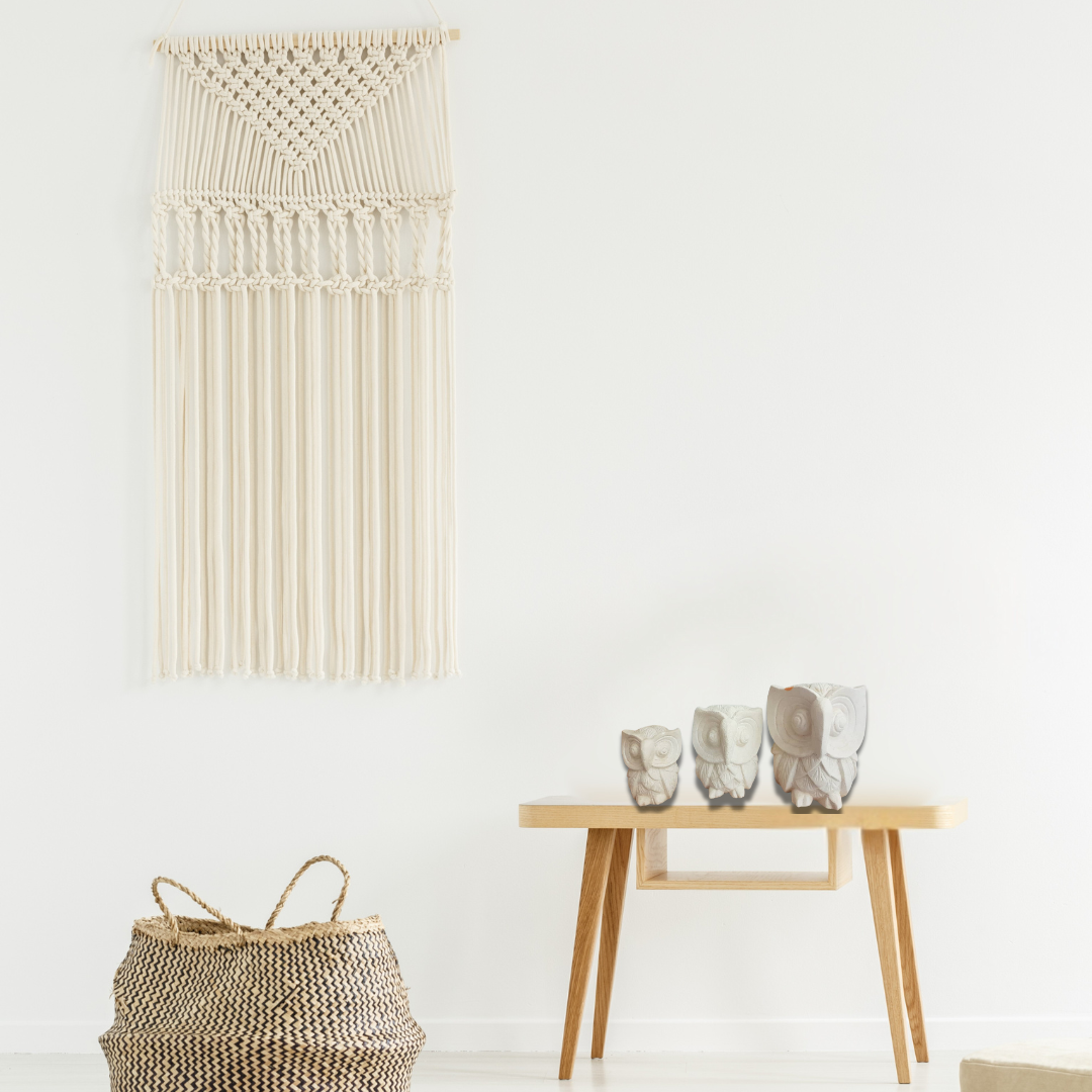 A set of three limestone carvings of owls in decreasing size order, from largest to smallest, living room boho style