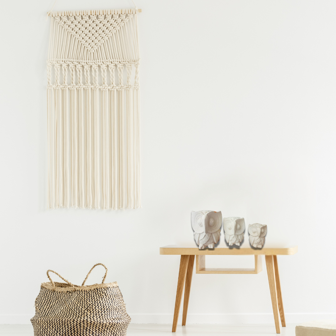 A set of three limestone carvings of owls in decreasing size order, from largest to smallest, living room boho style