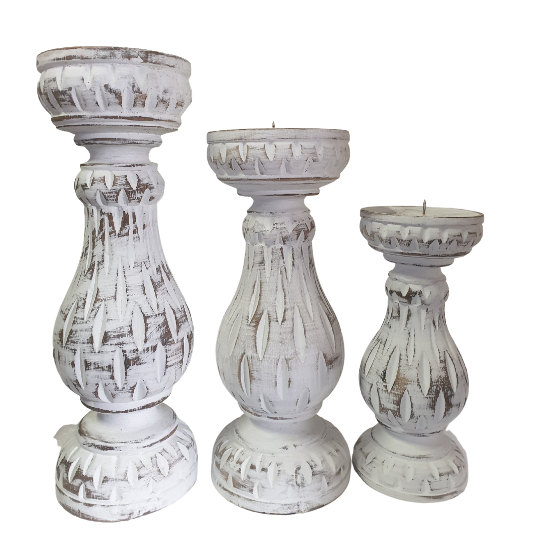 Three graduated pillar stands displayed side by side on a white background, showing size variation from tall to small with intricate leaf relief detailing