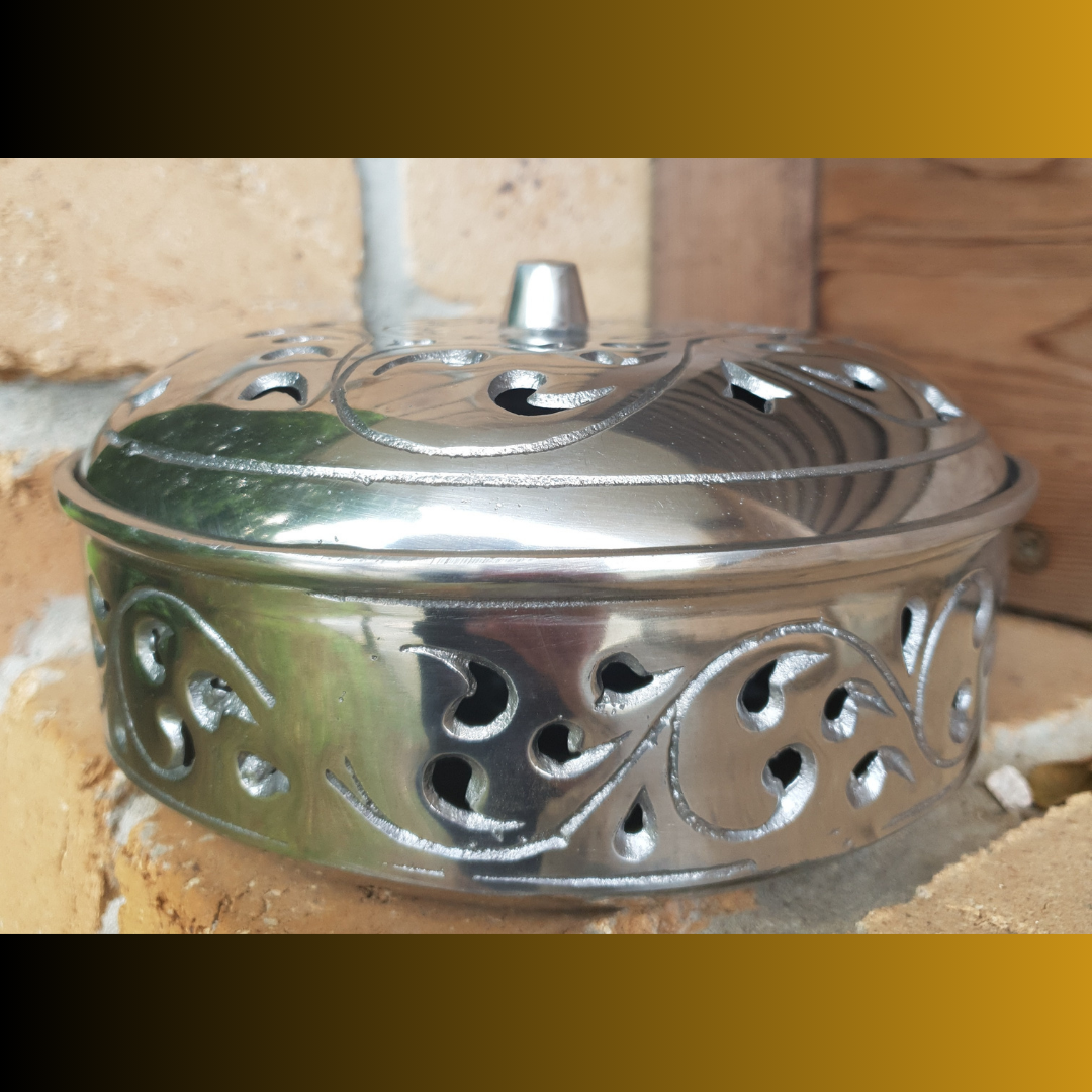 Decorative metal lantern on a wooden background