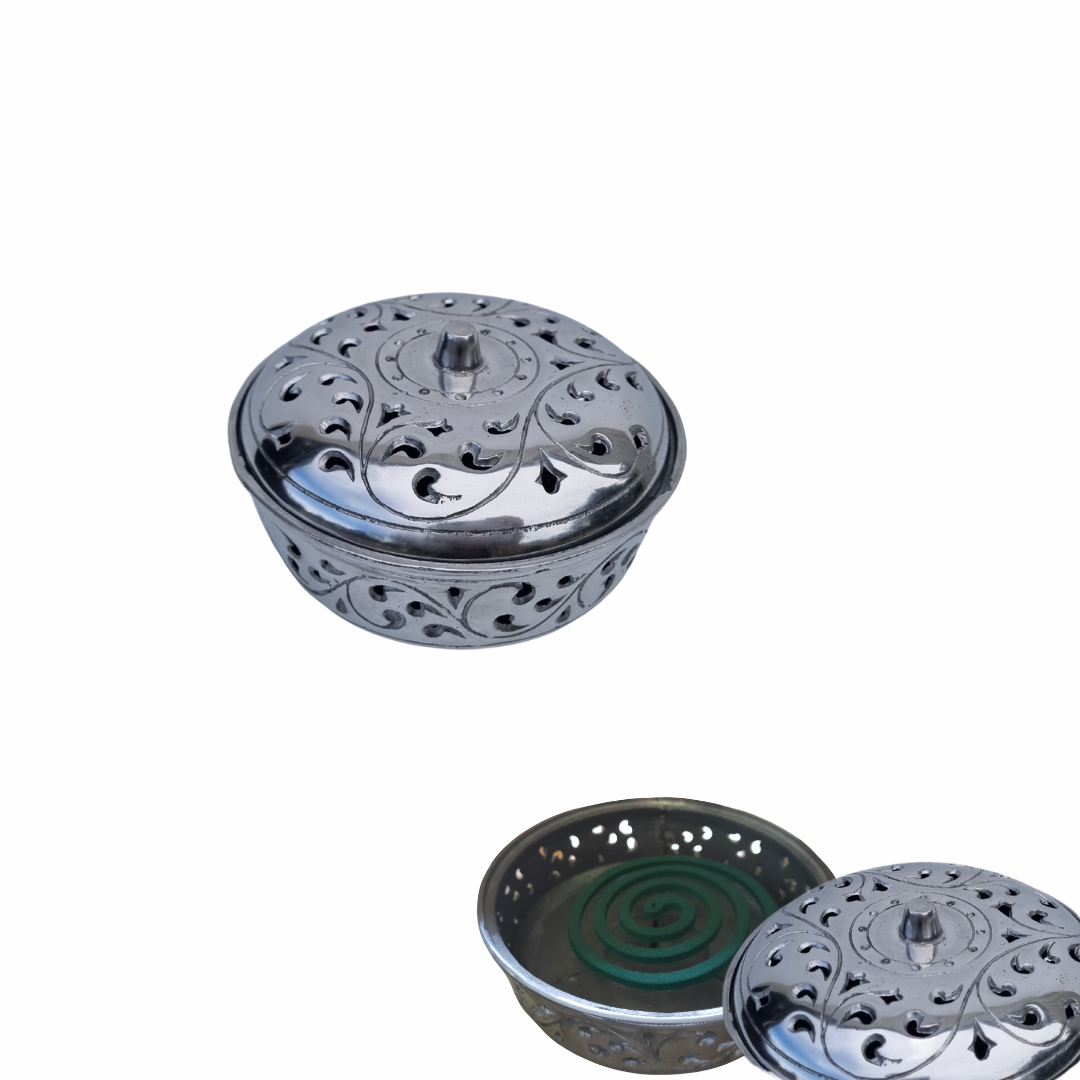 Metallic incense burner with perforated design on a white background