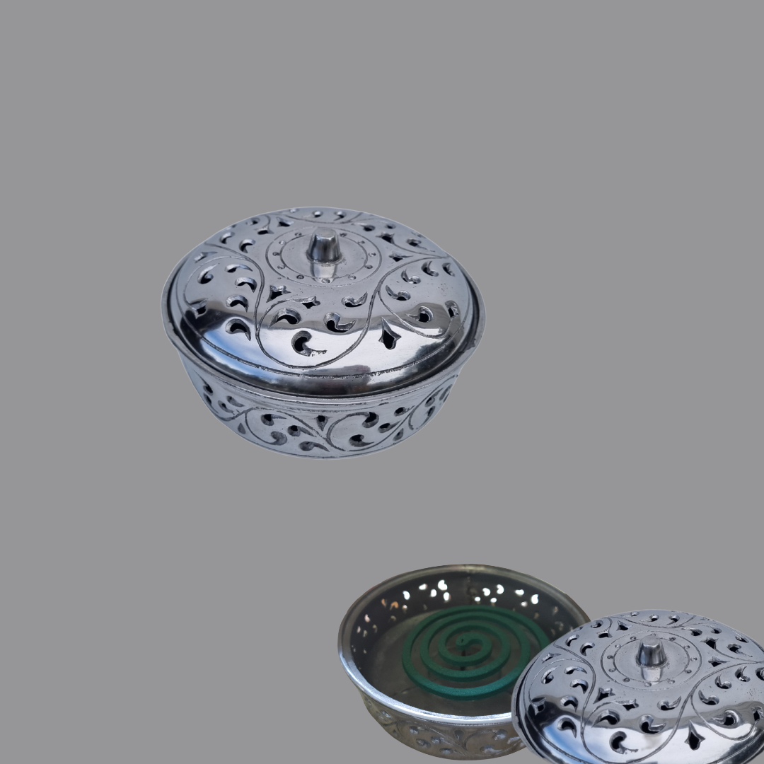 Metallic incense burner with perforated design on a silver 