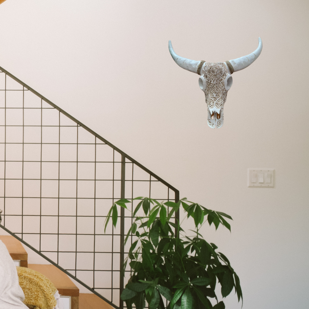Bull skull wall decal above a plant and staircase