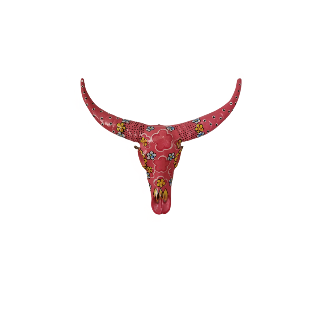 Handcrafted Floral Resin Bull Skull in Light Pink with intricate yellow, white and blue floral patterns and dotted detailing, 45cm x 25cm bohemian wall art by Azure Decor
