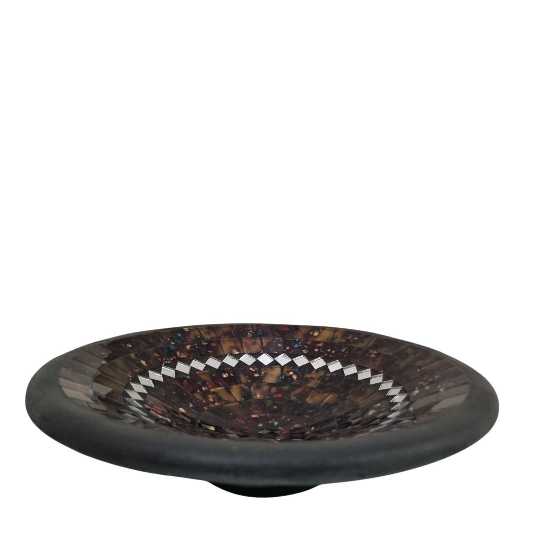 Decorative glass bowl with a mosaic pattern on a white background