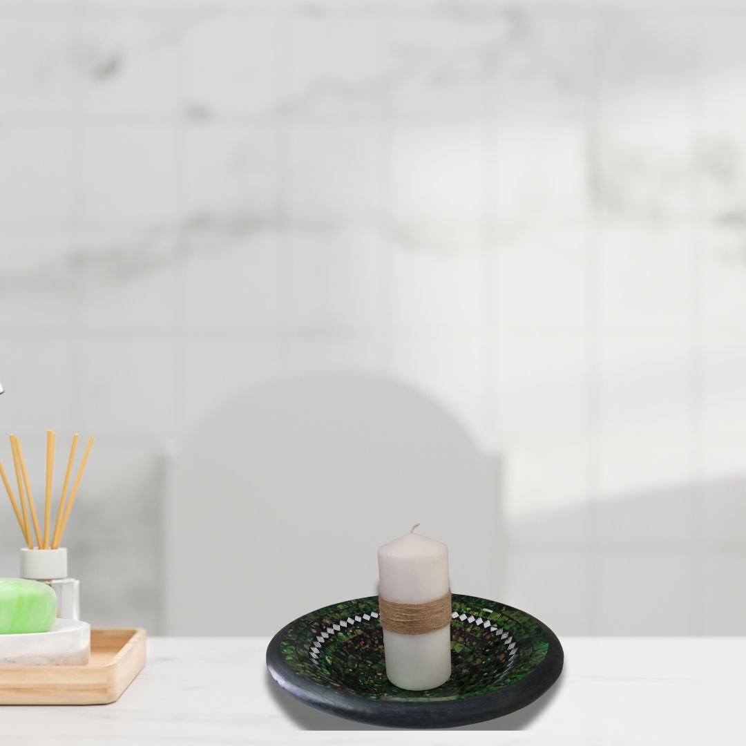 Candle on a decorative plate with a blurred background