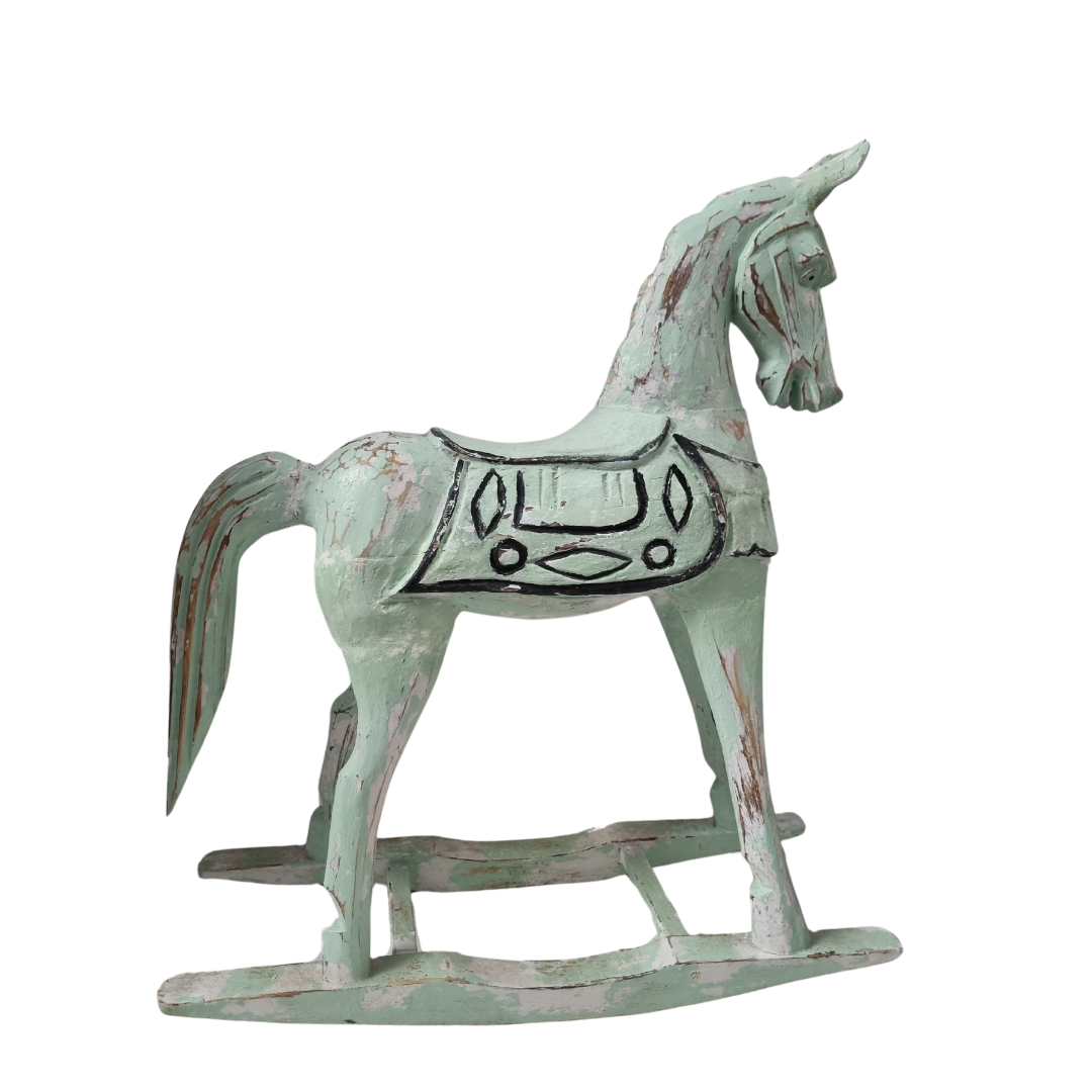 Full side profile of a sage green distressed timber design hand-carved saddle detail and curved rocker base