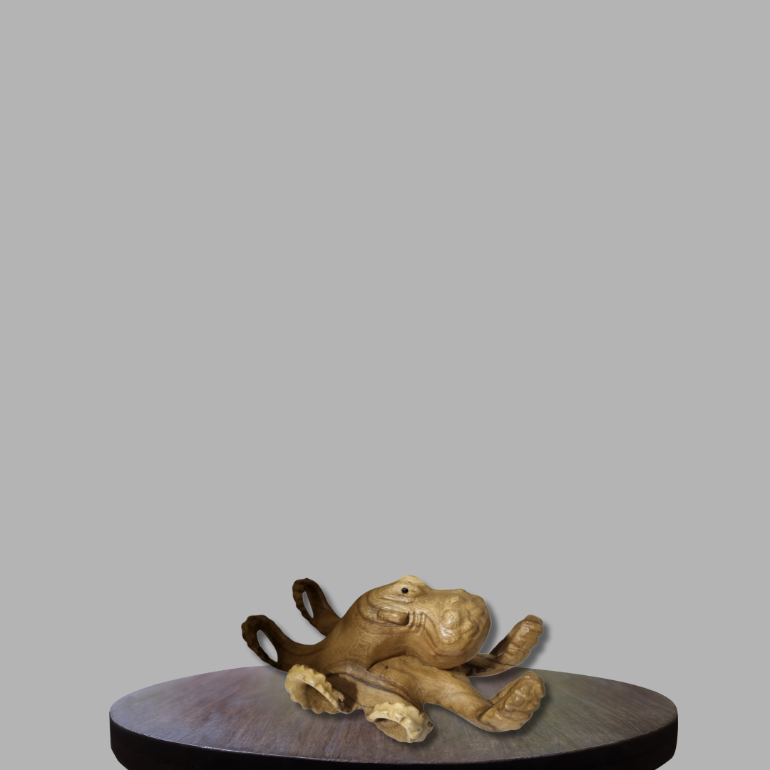 Wooden octopus sculpture on a round wooden platform with a gray background