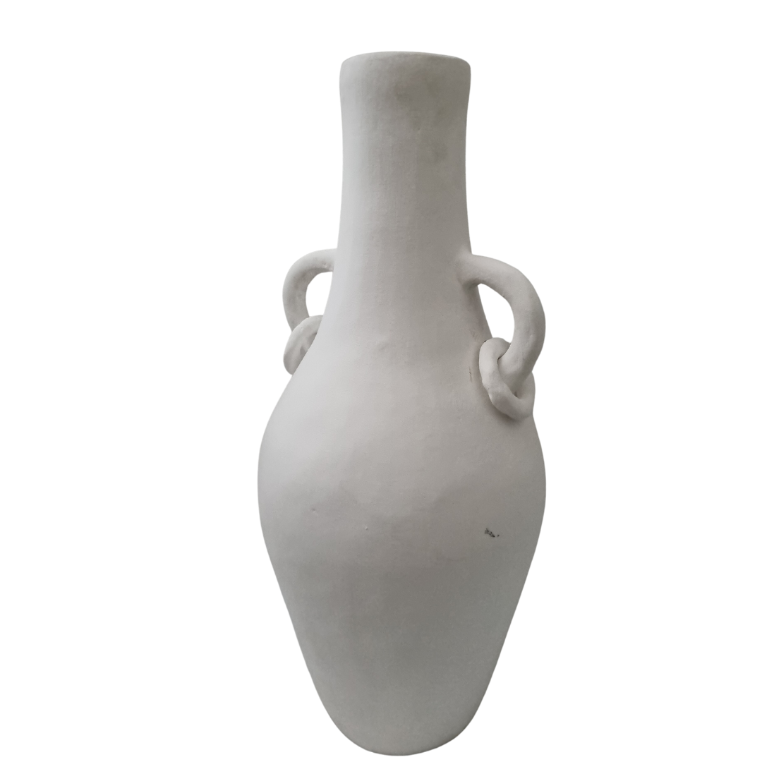 Matte white terracotta vase with looped ring handles, slight angle view showing elongated body tapering to pointed base 
