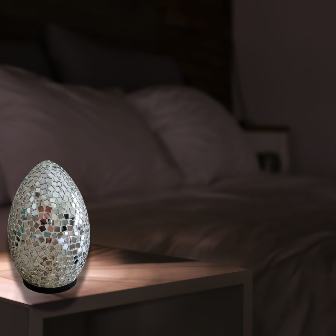 Two oval mosaic art lamps in multicolor, with a geometric pattern, designed for home decor.