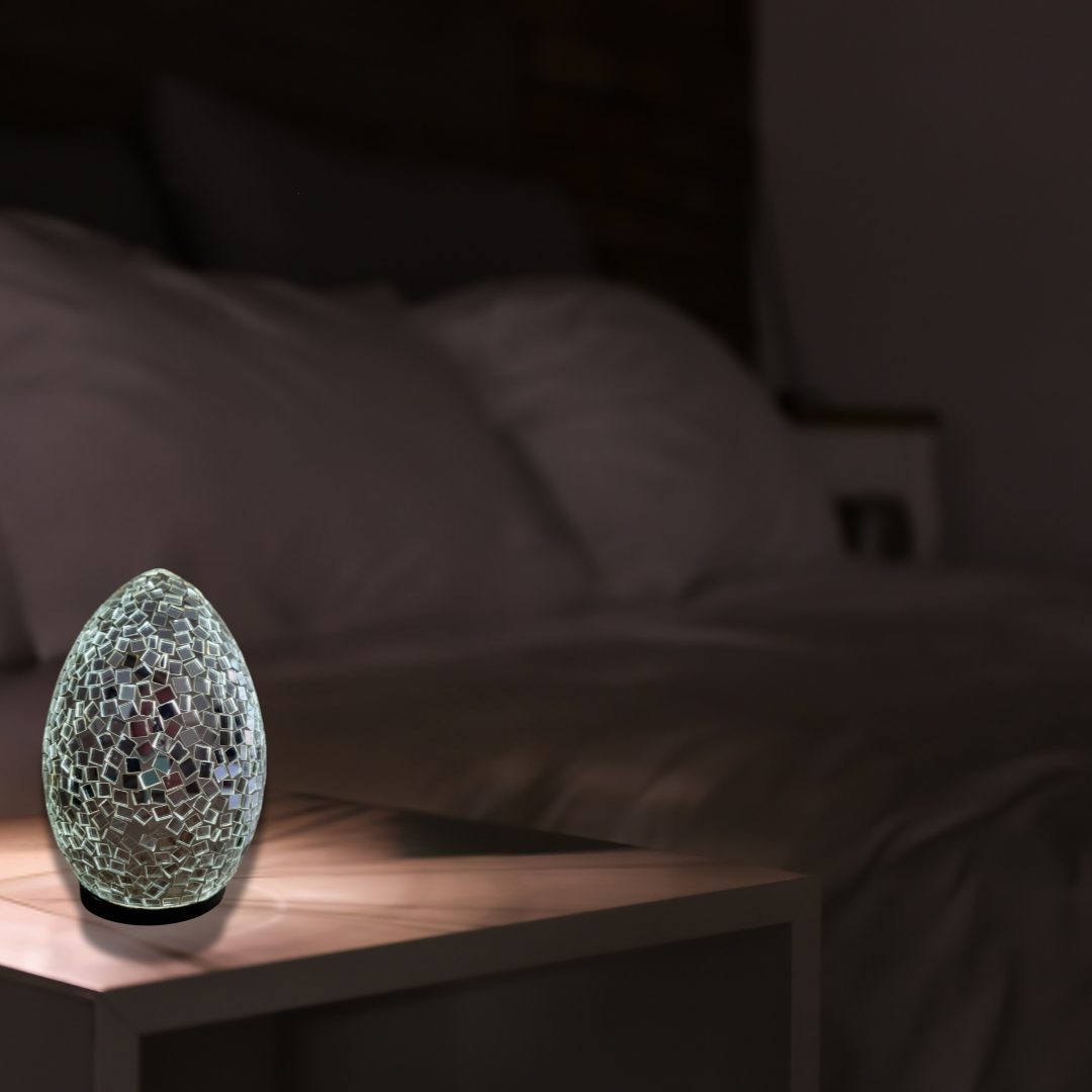 Two oval mosaic art lamps in multicolor, with a geometric pattern, designed for home decor.