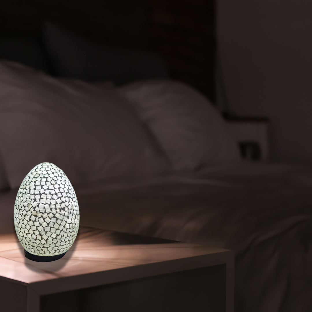 Two oval mosaic art lamps in multicolor, with a geometric pattern, designed for home decor.