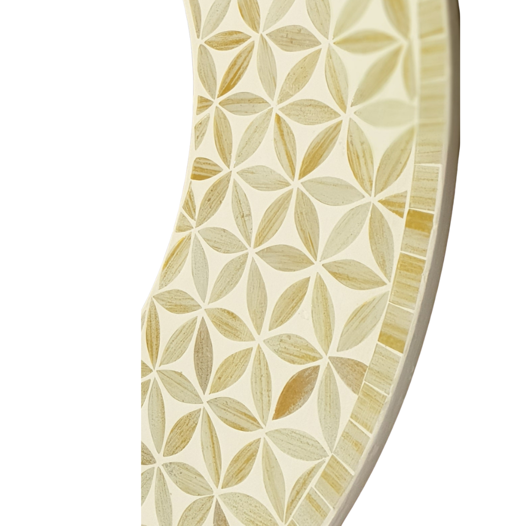 Close-up detail round mosaic mirror showing Flower of Life pattern in natural cream and warm ivory mosaic tiles