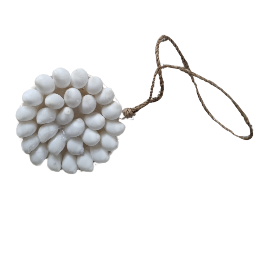 White spherical ornament with a string on a white background