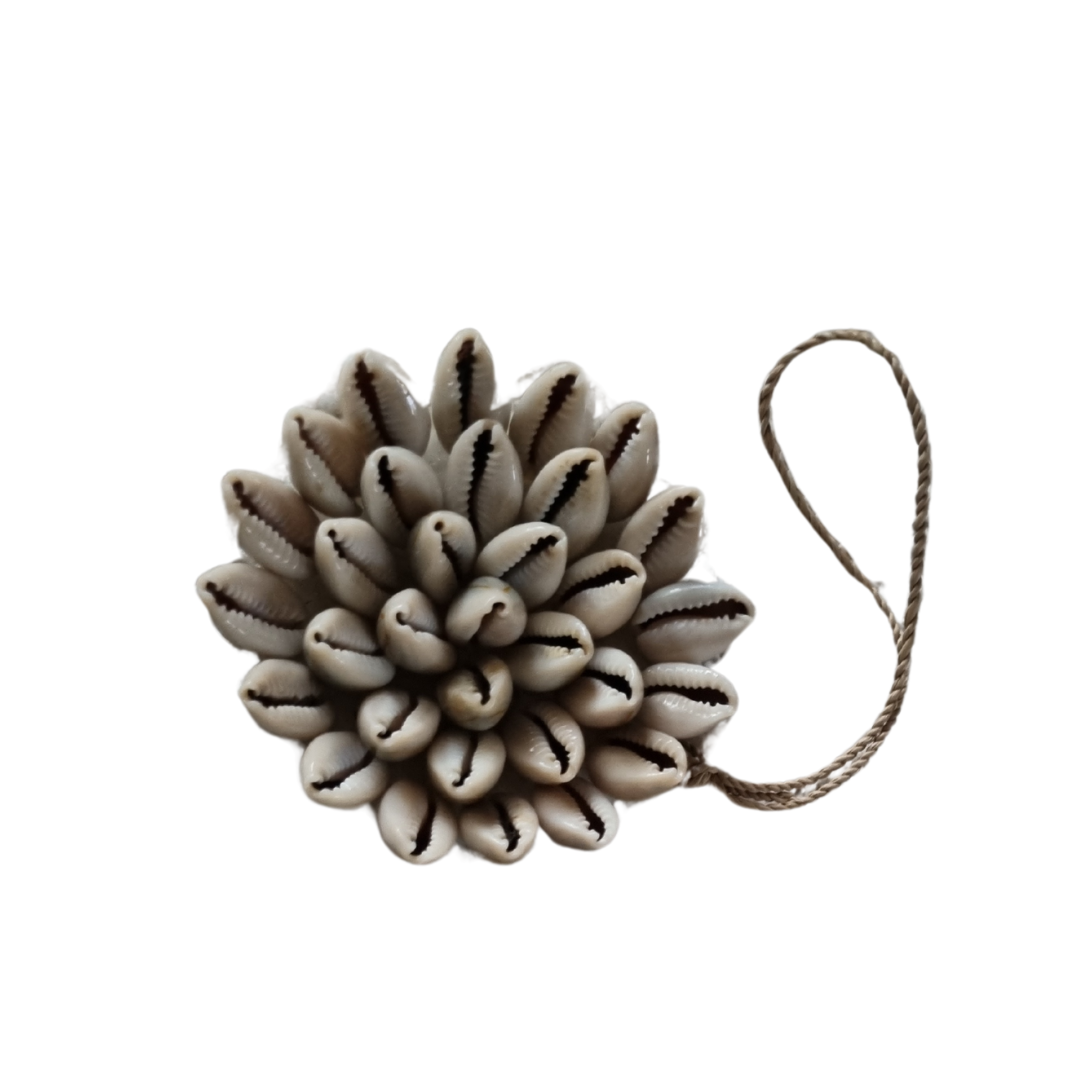 Decorative item with shell-like design on a white background
