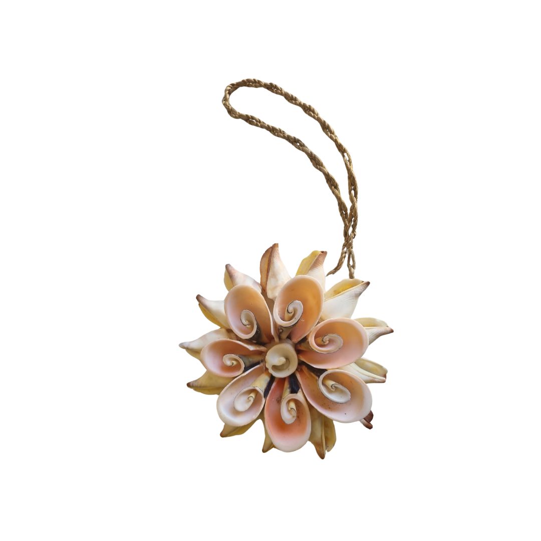 Decorative shell flower ornament with a string on a white background