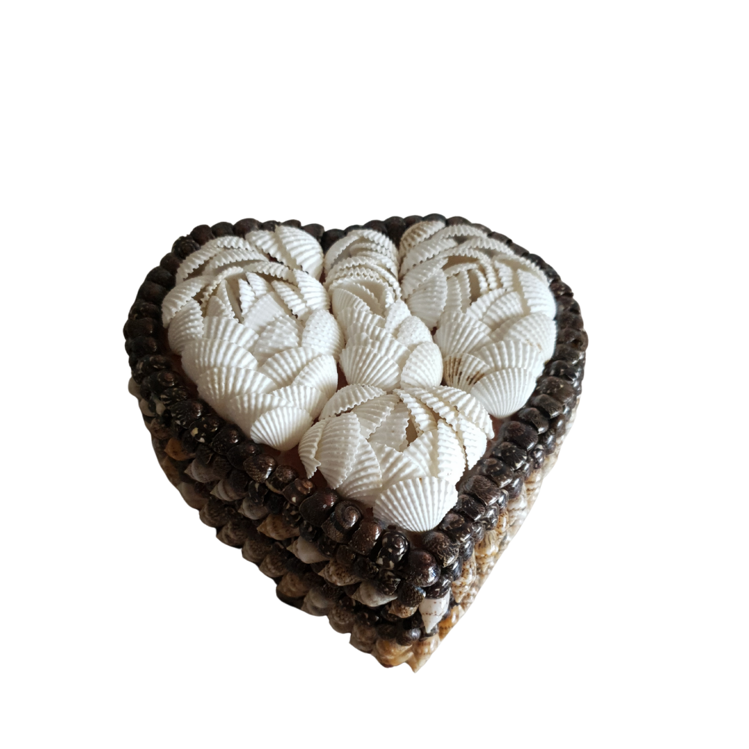 heart shaped trinket box with a black interior and a white shell