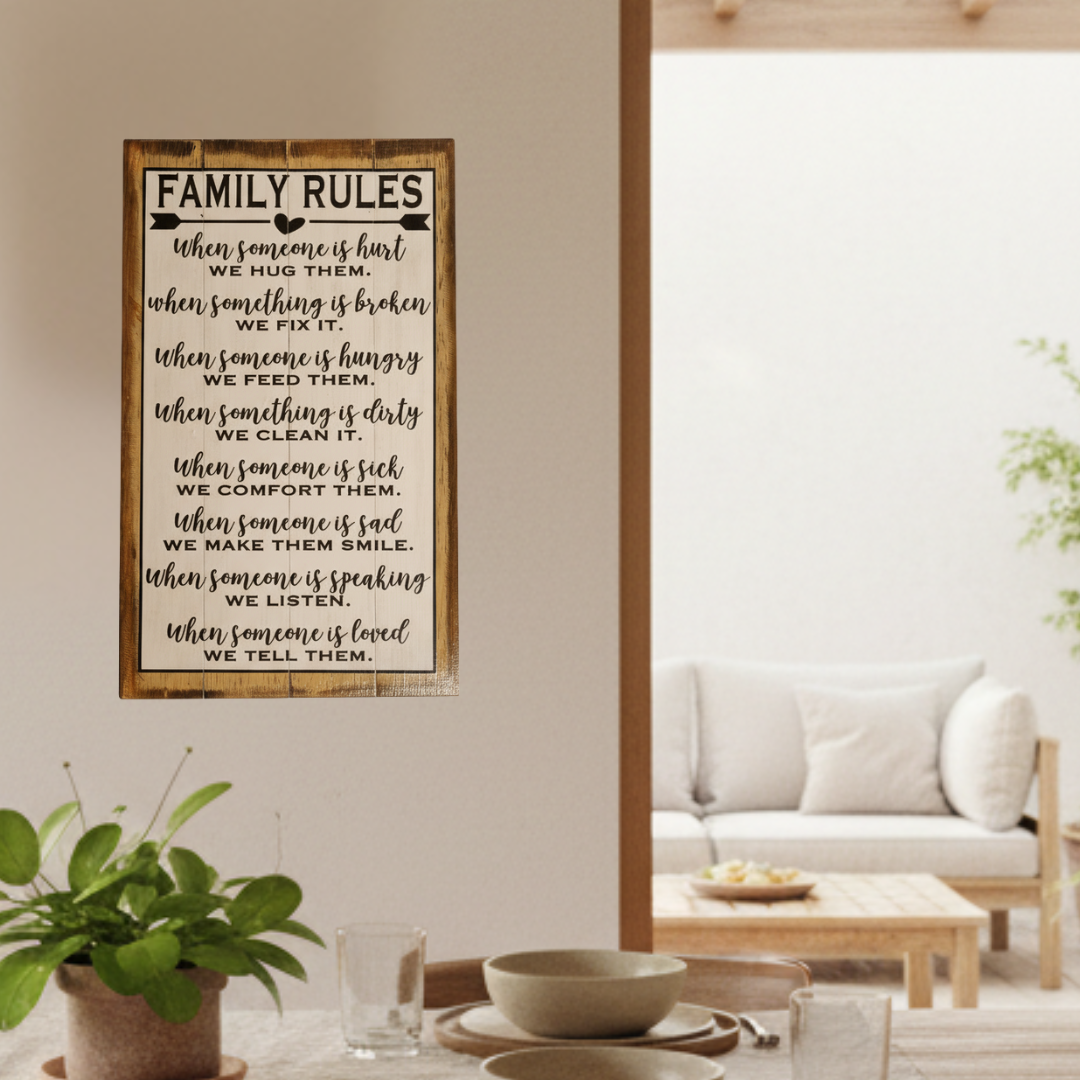 Family dining area with a framed Family Rules plaque, potted plant and bright living room beyond