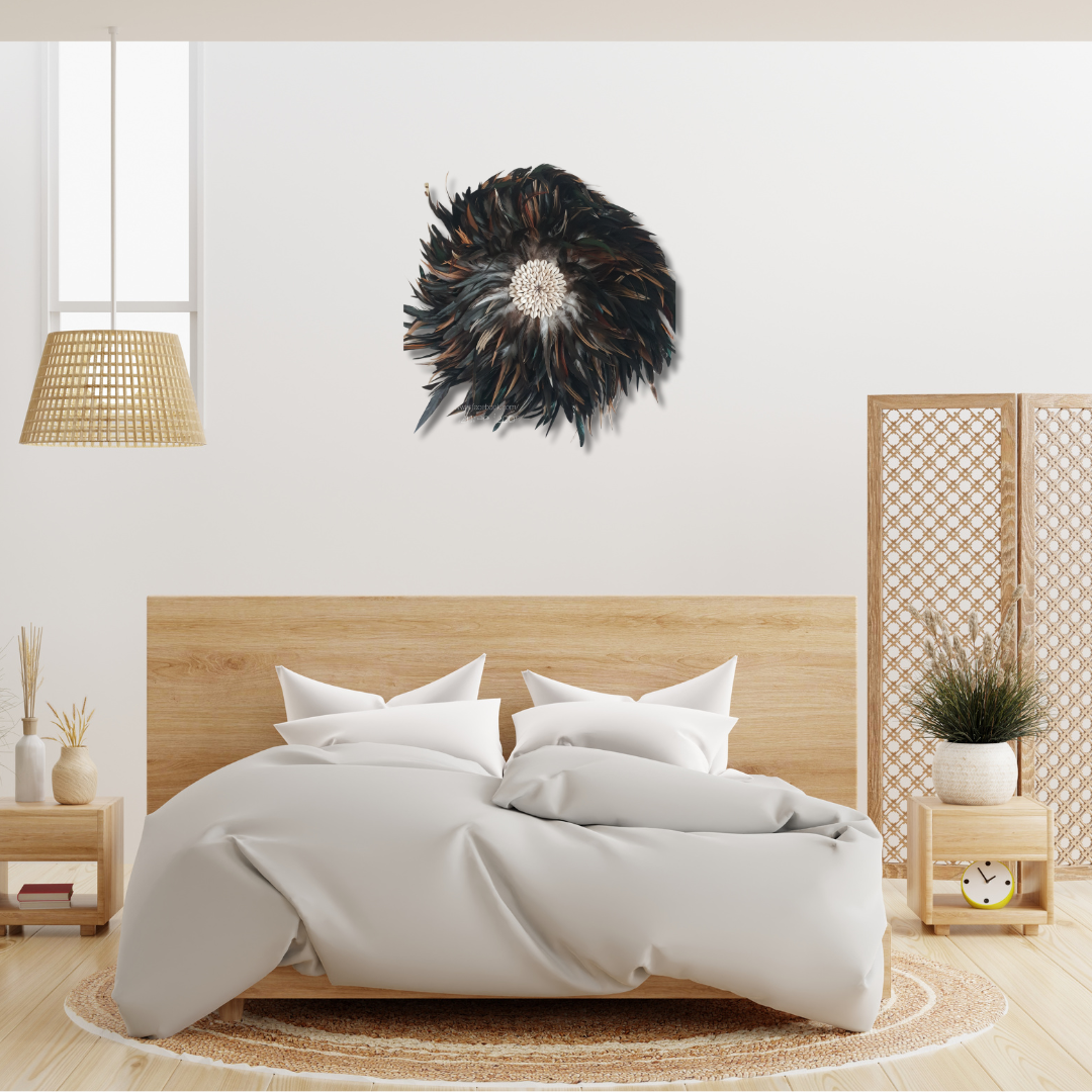Handcrafted Balinese Juju Hat wall hanging with layered dark feathers and a cowrie shell centre, styled above a bed in a boho-inspired bedroom. Decorative boho wall décor measuring 40–50cm, adding texture and natural warmth to the space.