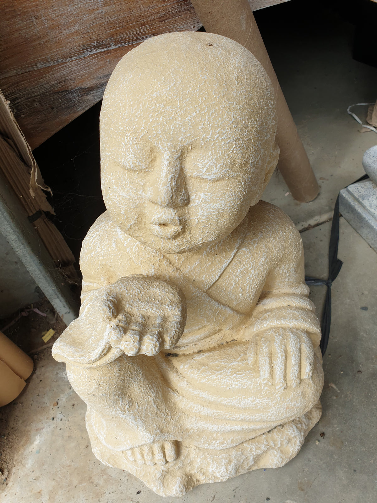 sandstone colour statue set on a floor
