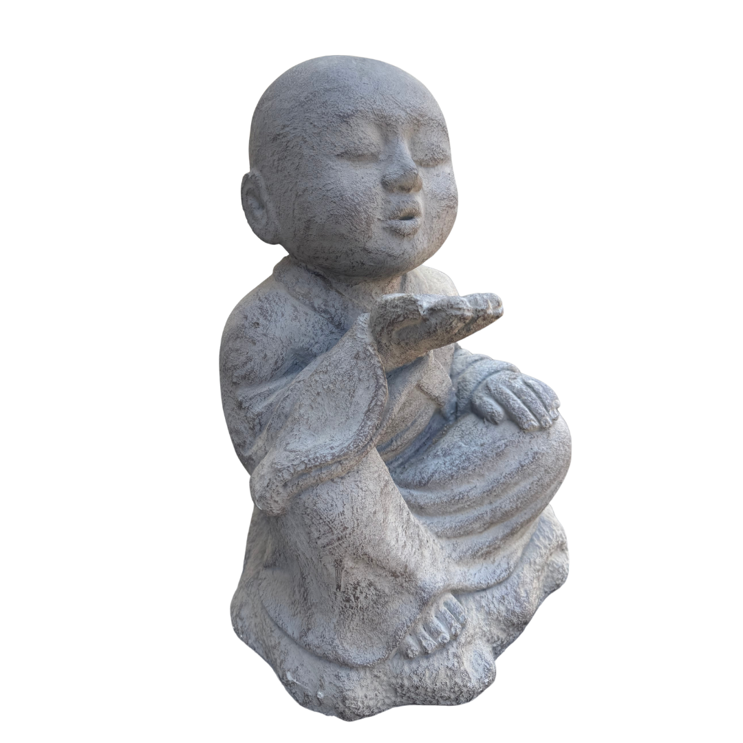 A small seated Buddha statue in a weathered stone-like gray finish, shown against a plain white background.