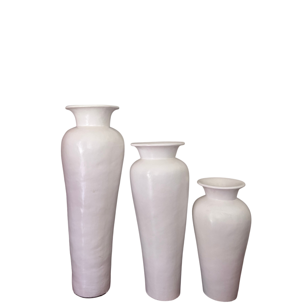 Three white vases of different sizes on a white background