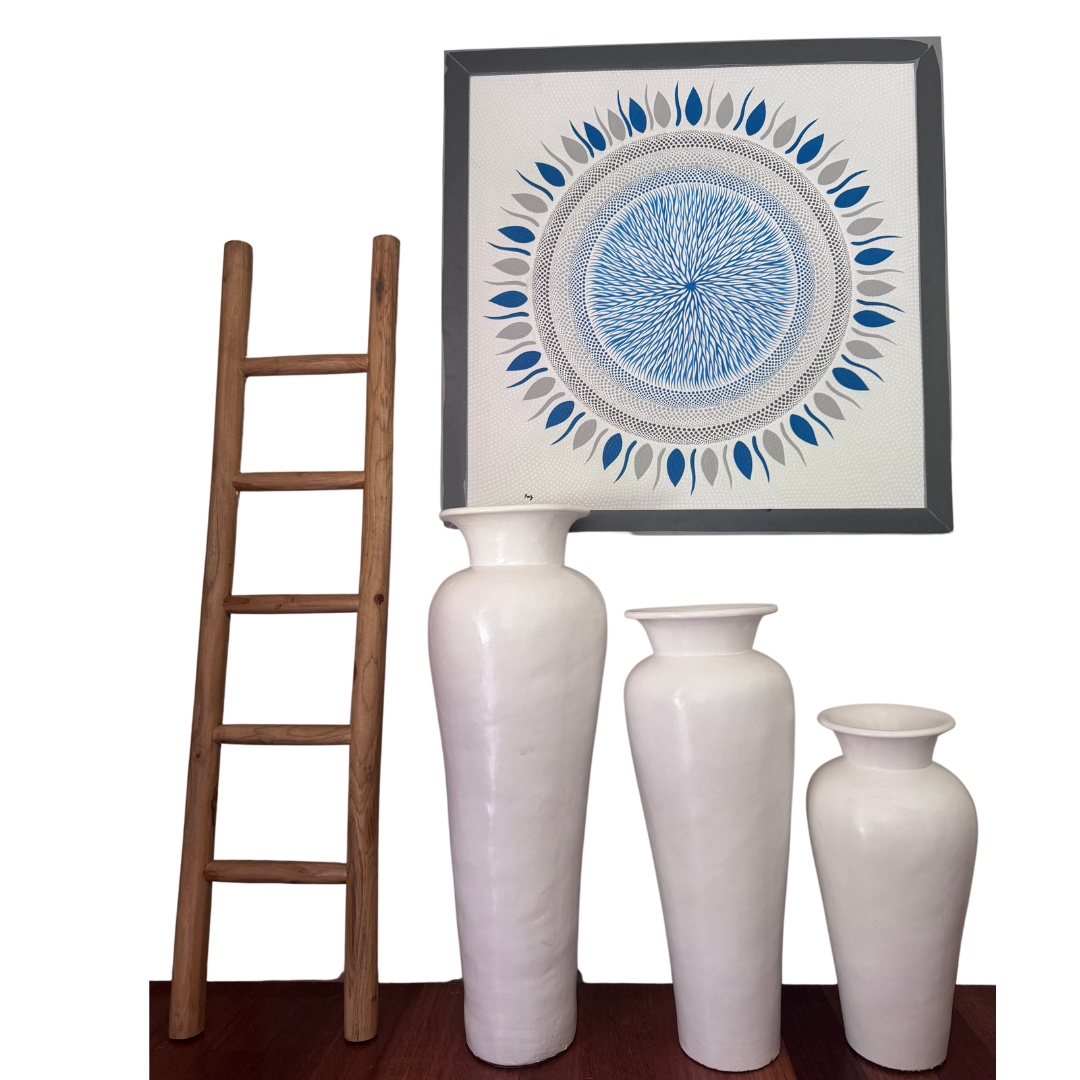 Decorative vases and a framed artwork on a white background