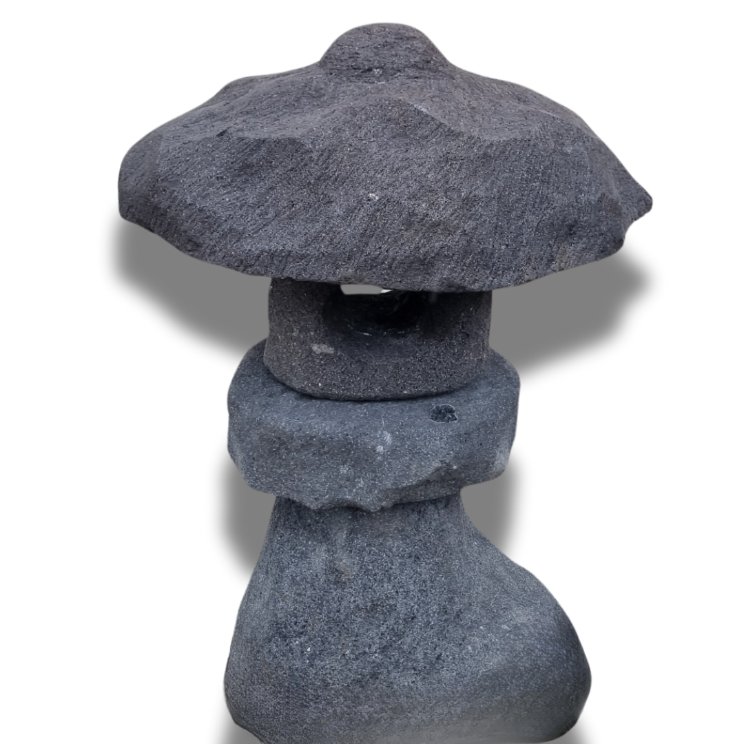  Style 2 on white background — dark grey stone with stacked sections, open light chamber and natural rough-hewn texture