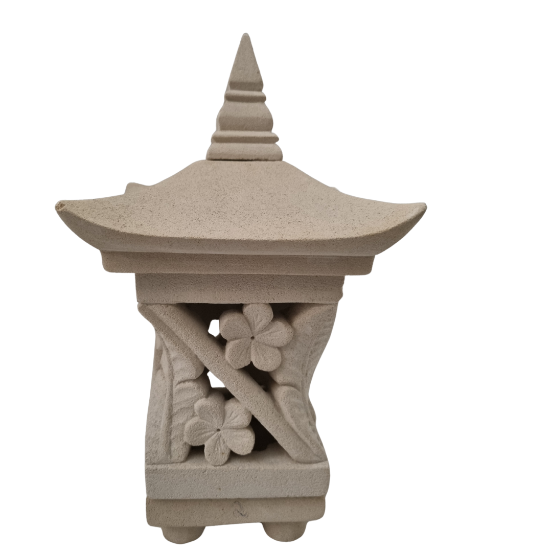 Hand-carved stone pagoda lantern with daisy flower motif on white background